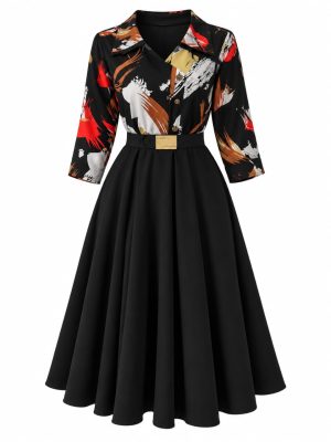 Robe noire évasée à imprimé abstrait multicolore avec ceinture dorée